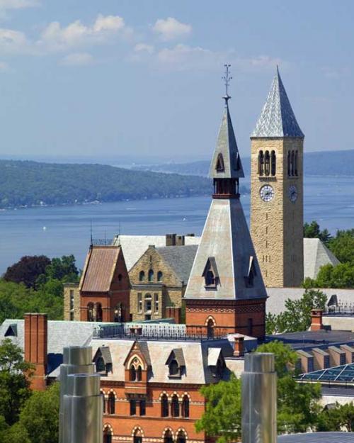 		campus buildings with lake in background
	