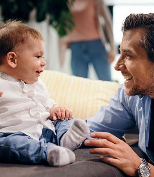 		 Father smiling at baby
	