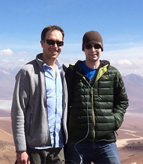 		 researchers on hill in desert
	