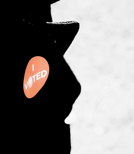 		 &quot;I Voted&quot; sticker on a coat lapel
	