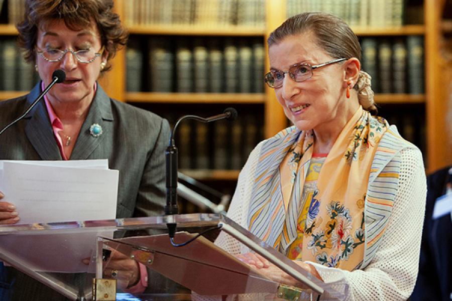 Ruth Bader Ginsburg, speaking at a podium