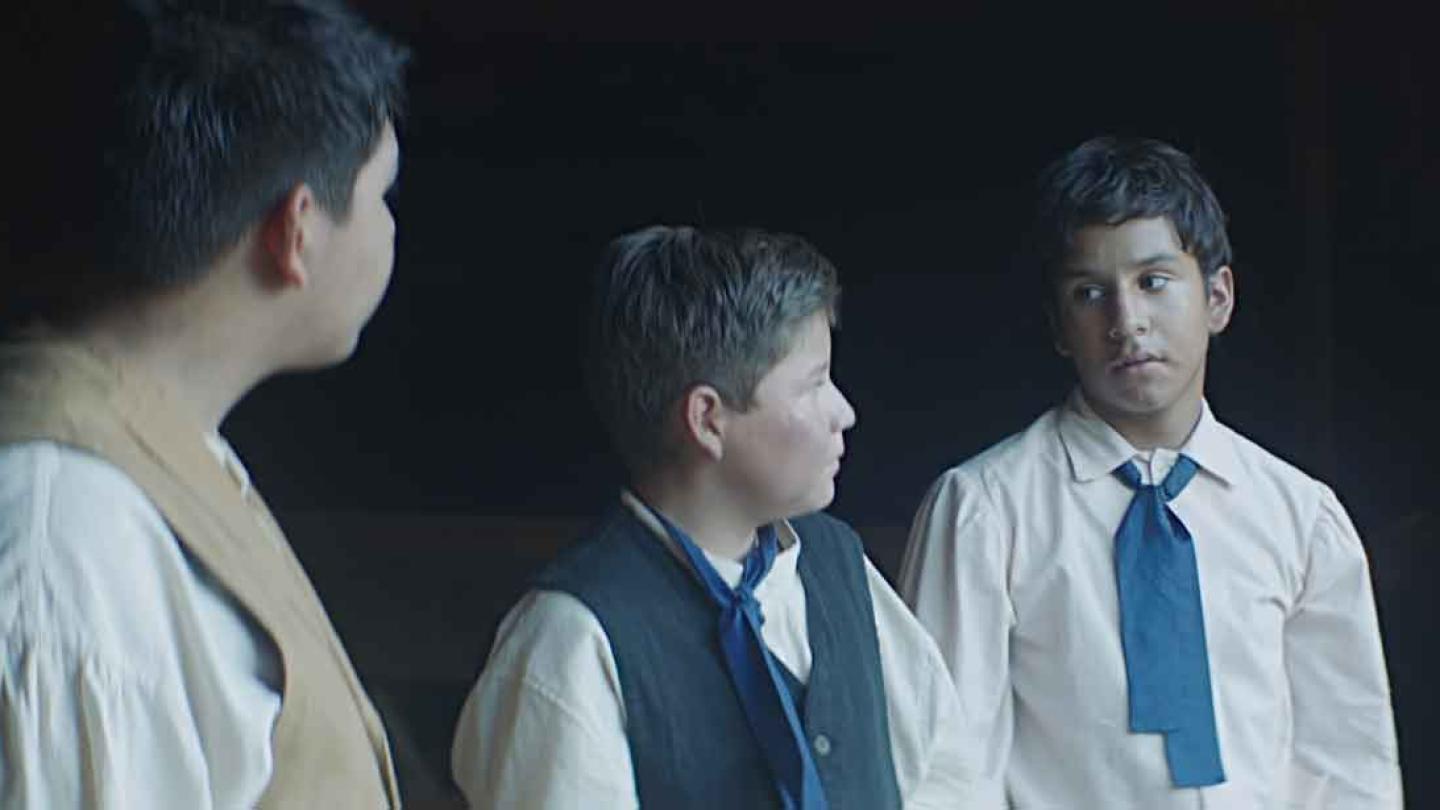 Three boys talking