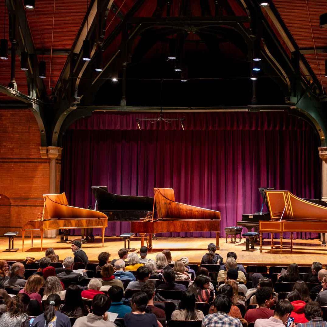 		three pianos on a stage
	