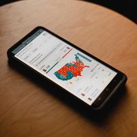  phone on table showing a colored map