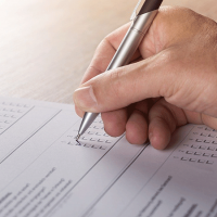 Hand with pencil, marking a ballot