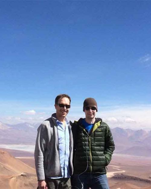 two people on top of a mountain