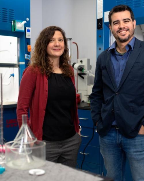 Two people stand in a lab