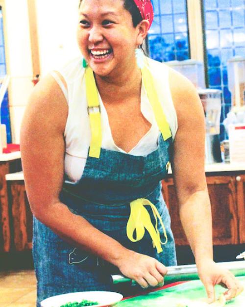 Person cooking in a dining hall