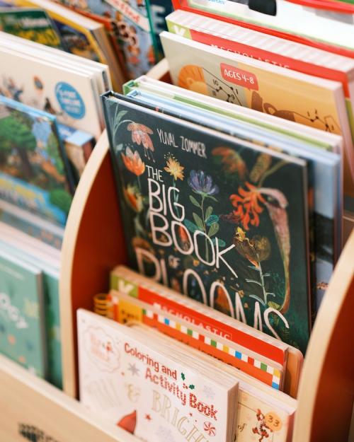 Colorful picture books in a bin