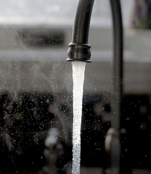  A stream of water coming out of a faucet