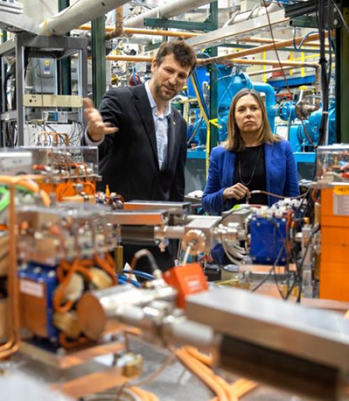  Georg Hoffstaetter, professor of physics, and Alicia Barton, president and CEO of the New York State Energy Research and Development Authority, tour the Cornell-Brookhaven ERL Test Accelerator facility.