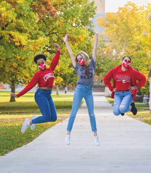  Three people jump in the air