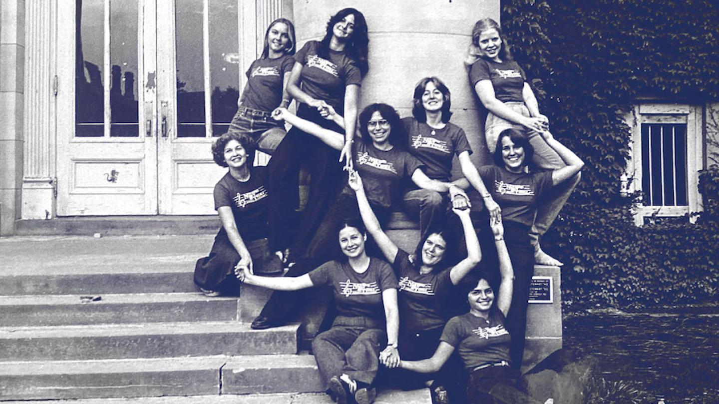 Ten people wearing matching t-shirts